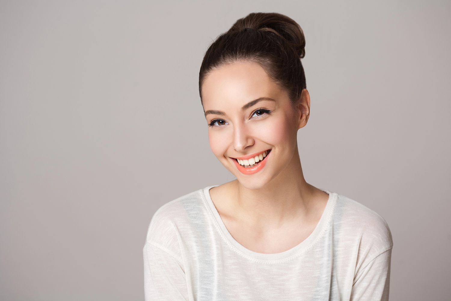 Portrait of a beautiful charming happy brunette woman.